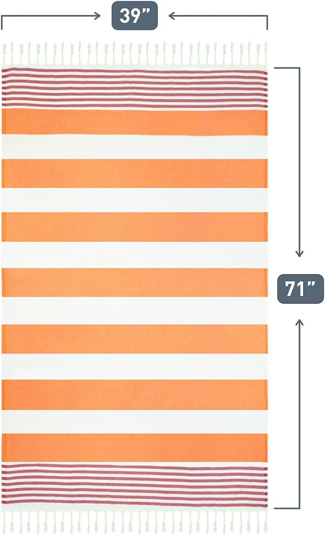 Orange and white striped Turkish-style towel shown flat with dimension annotations: 39 inches wide and 71 inches long. Features narrow pink\/red accent stripes near both ends and white fringe along the short edges.
