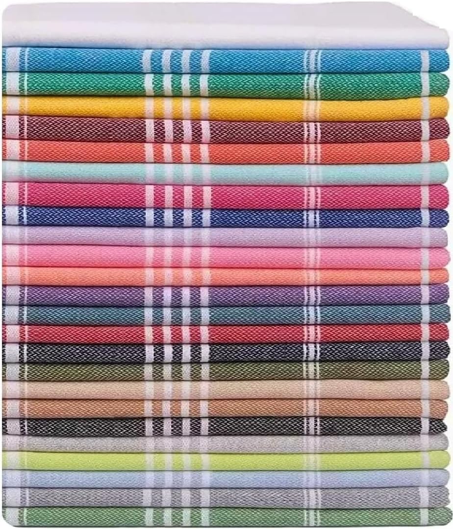 A tall stack of approximately 20 folded flat-woven towels in a wide variety of colors, each featuring white stripe accents near the edges. Colors include white, teal, yellow, red, green, pink, blue, purple, coral, dark gray, beige, olive, and light green.